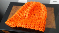 Orange hand knitted hat, winter fashion